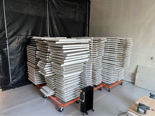 PRODRYINGRACK KD (PDRKD) IN USE MULTIPLE FILLED WITH WHITE CABINET DOORS DRYING ON RACKS
