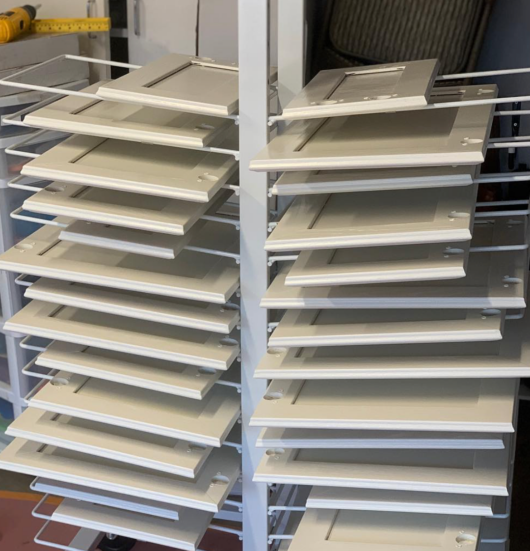PRODRYINGRACK KD (PDRKD) IN USE WITH WHITE CABINET DOORS DRYING ON RACK