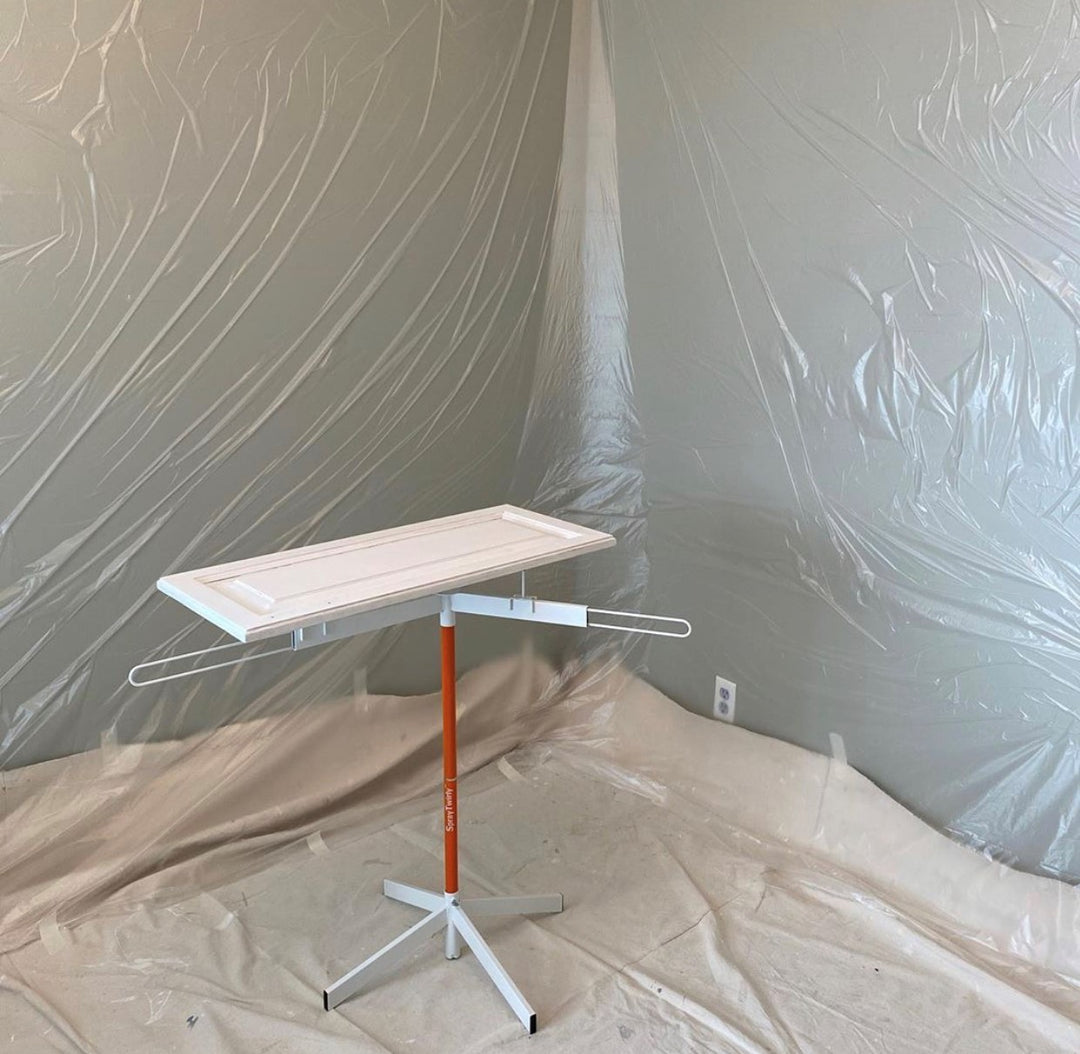 SPRAYTWIRLY (SPTY) IN USE WITH WHITE CABINET DOOR ON TOP OF ROTATING SPRAY TABLE