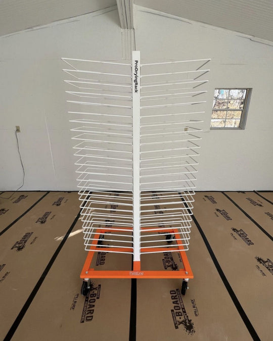 White wire rack with orange base, used to hold cabinet doors for drying and organization