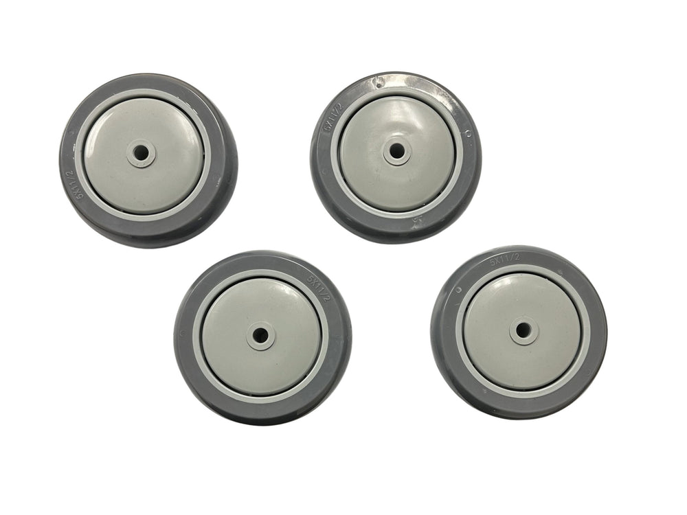 Four gray caster wheels on a white background