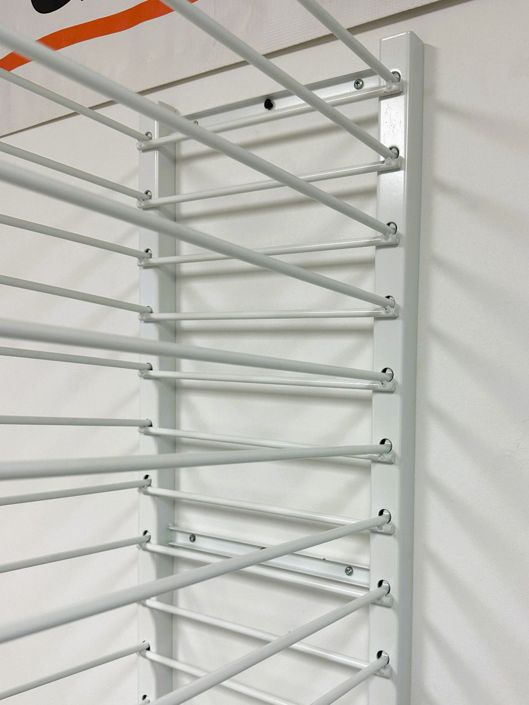 CLOSEUP OF PRODRYINGRACK WALL MOUNT (PDRWM) MOUNTED ON WALL.