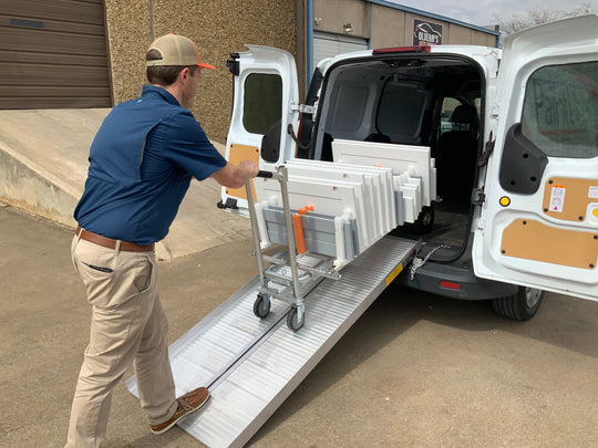 PRODRYINGRACK TRANSPORT (PDRTR) HANDTRUCK ROLLING INTO PAINTLINE VAN BACK VIEW