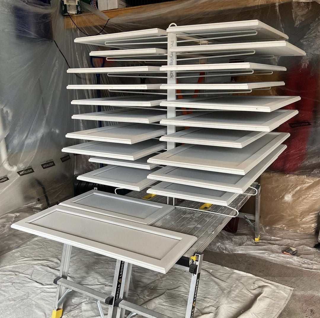 PRODRYINGRACK TT (PDRTT) IN USE ON TABLE TOP WITH WHITE CABINET DOORS ON RACK