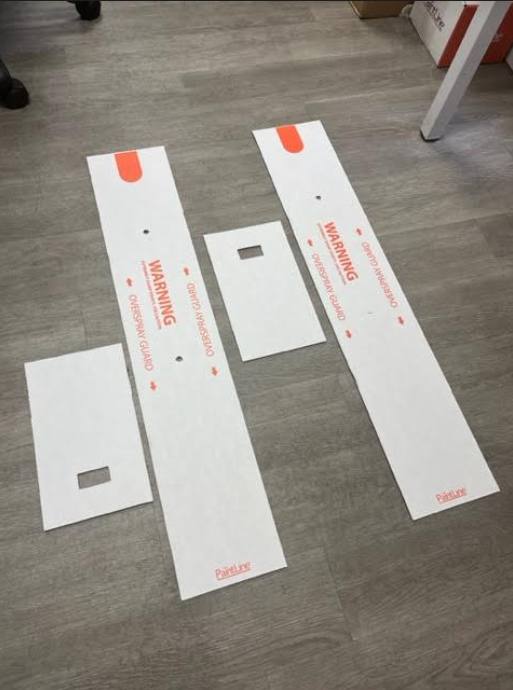 INTERIOR DOOR SPRAY AND DRY SERIES (PSDRID) OVERSPRAY GUARDS LAYING ON FLOOR TO SHOW COMPONENTS