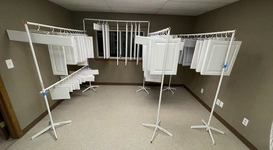 PRODRYINGRACK SD (PSDR) SERIES ACCESSORIES IN USE WITH WHITE CABINET DOORS HANGING VERTICALLY TO DRY