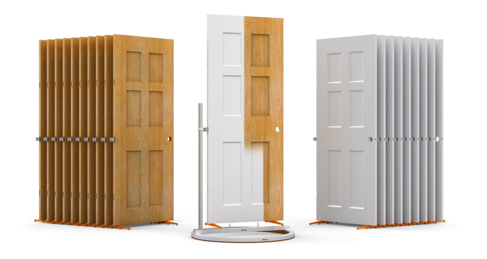 Interior Door Spray and Dry Series with brown unfinished doors standing to the left of the turntable, one door being painted white on the turntable in the center, and the finished white doors standing to the right of the turntable