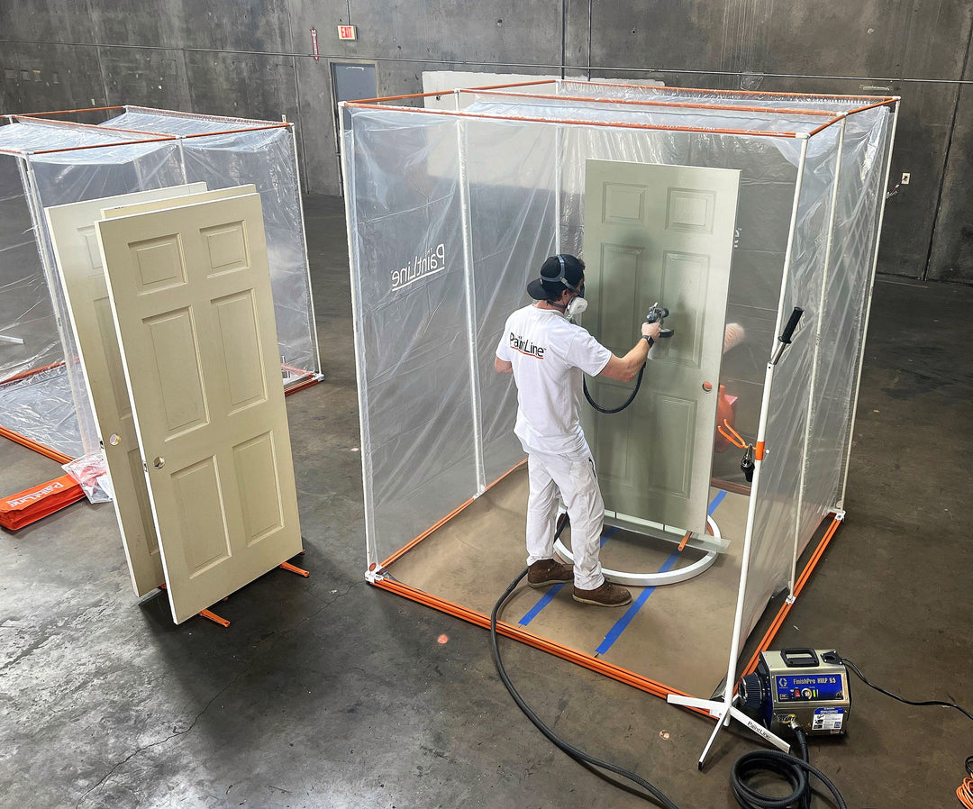 INTERIOR DOOR SPRAY AND DRY SERIES (PSDRID) IN USE INSIDE PORTABLE JOBSITE SPRAY BOOTH XL WITH INTERIOR DOOR BEING SPRAYED