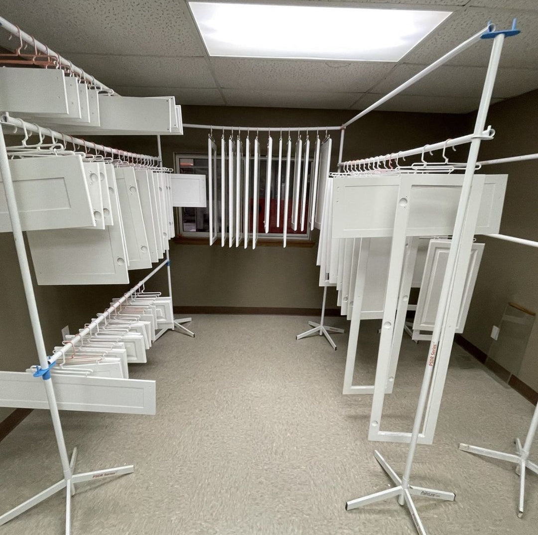 PRODRYINGRACK SD (PSDR) SERIES ACCESSORIES IN USE CUSTOMER IMAGE WITH WHITE CABINET DOORS HANGING ON RACK TO DRY