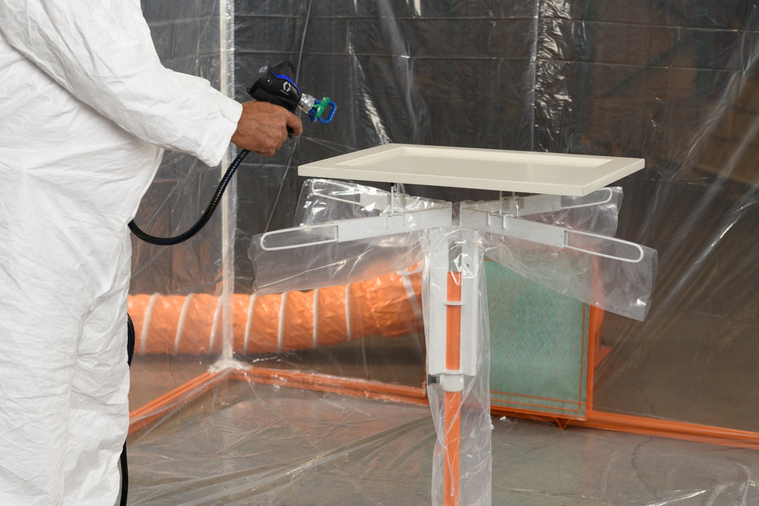 SPRAYTWIRLYHD (SPTYHD) BEING USED TO SPRAY A WHITE CABINET DOOR INSIDE SPRAY BOOTH