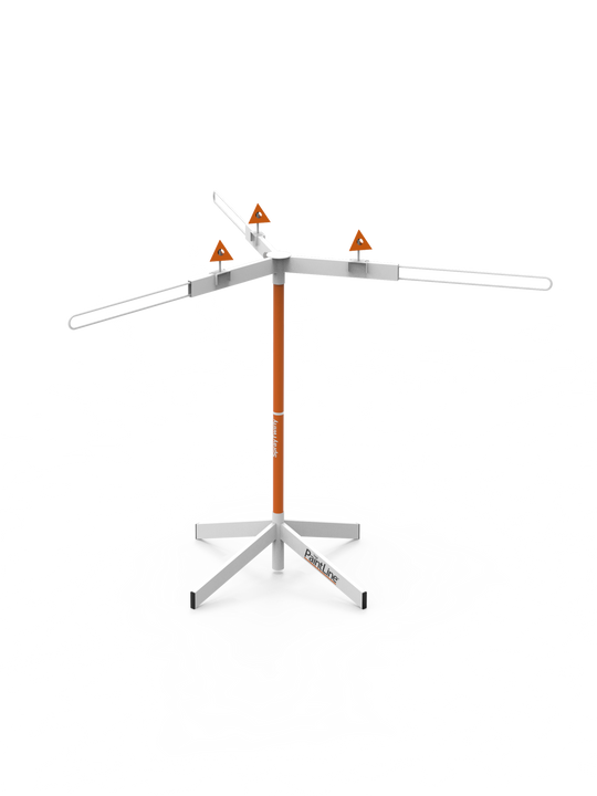 Rotating finishing stand with paint pyramids on a white background