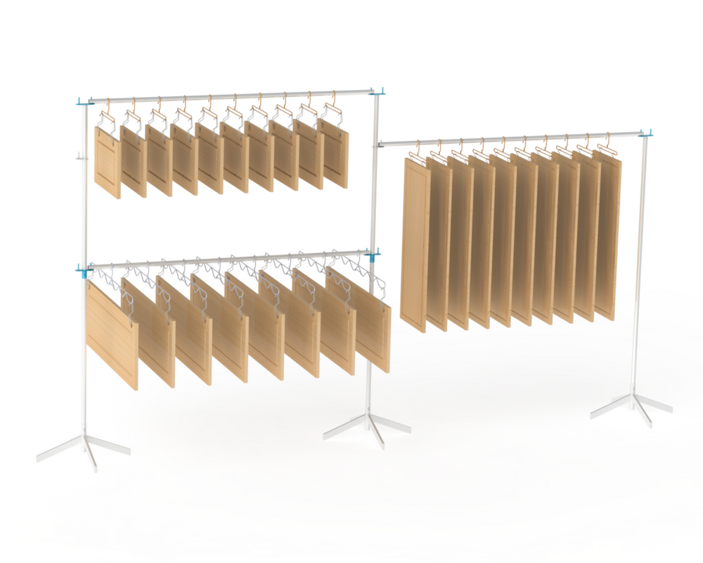 Metal rack system with metal hangers holding cabinet doors for drying on multiple levels