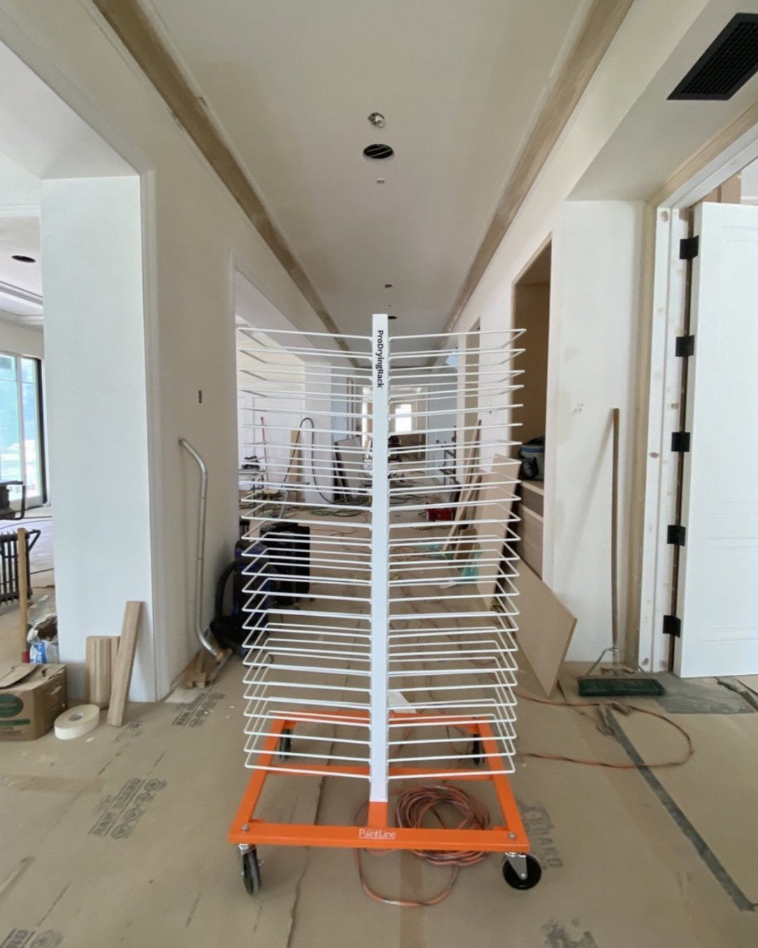 An empty PaintLine 50-shelf drying rack set up on a jobsite