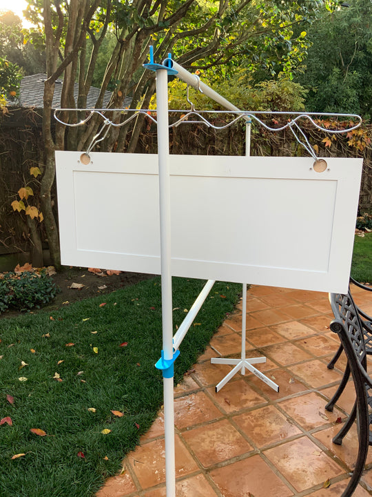 PRODRYINGRACK SD (PSDR) SERIES ACCESSORIES (WAVE HANGERS AND 2ND TIER CONNECTORS) IN USE WITH WHITE CABINET DOORS HANGING ON RACK TO DRY