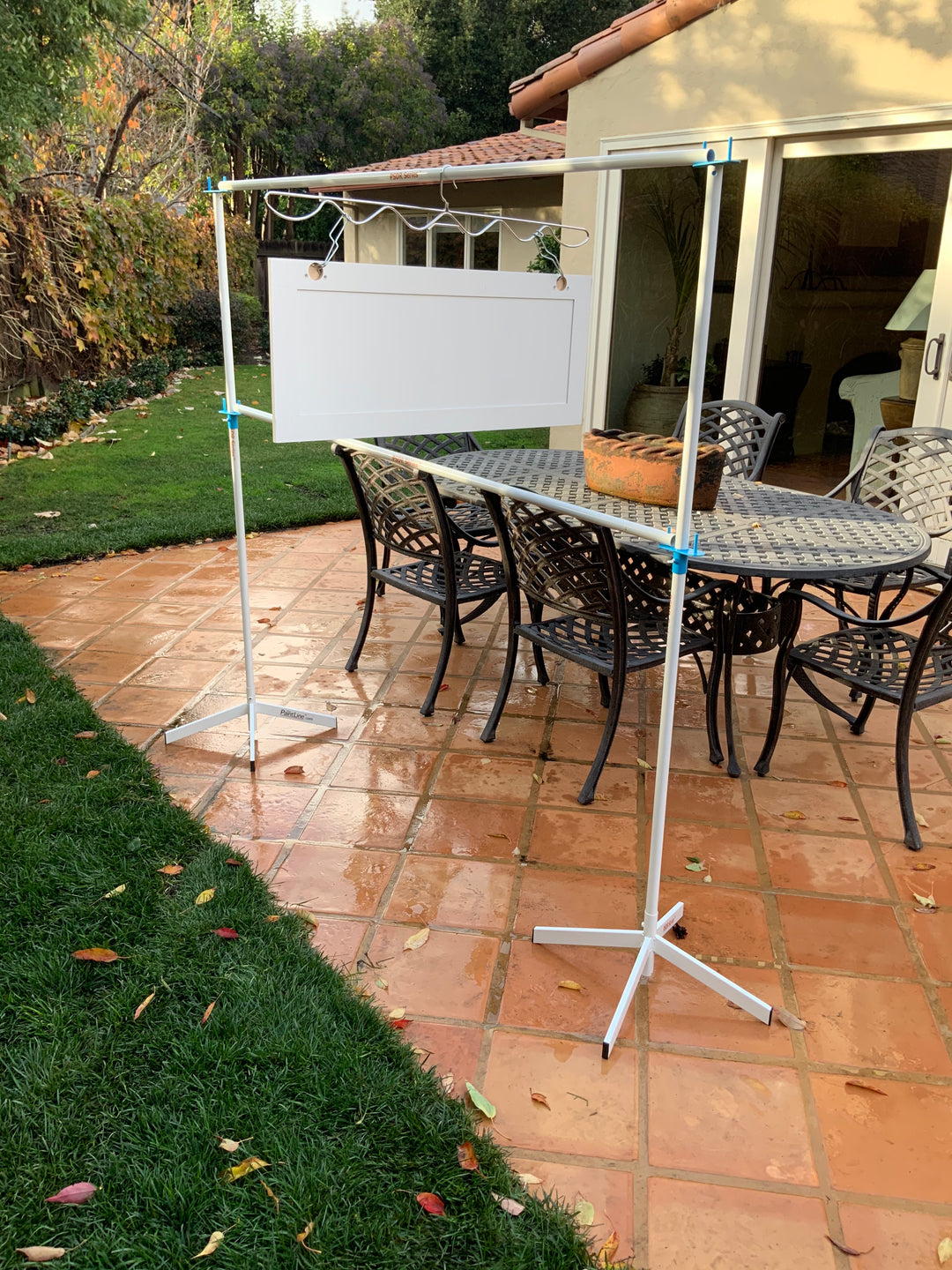 PRODRYINGRACK SD (PSDR) SERIES ACCESSORIES IN USE WITH WHITE CABINET DOORS HANGING ON RACK TO DRY